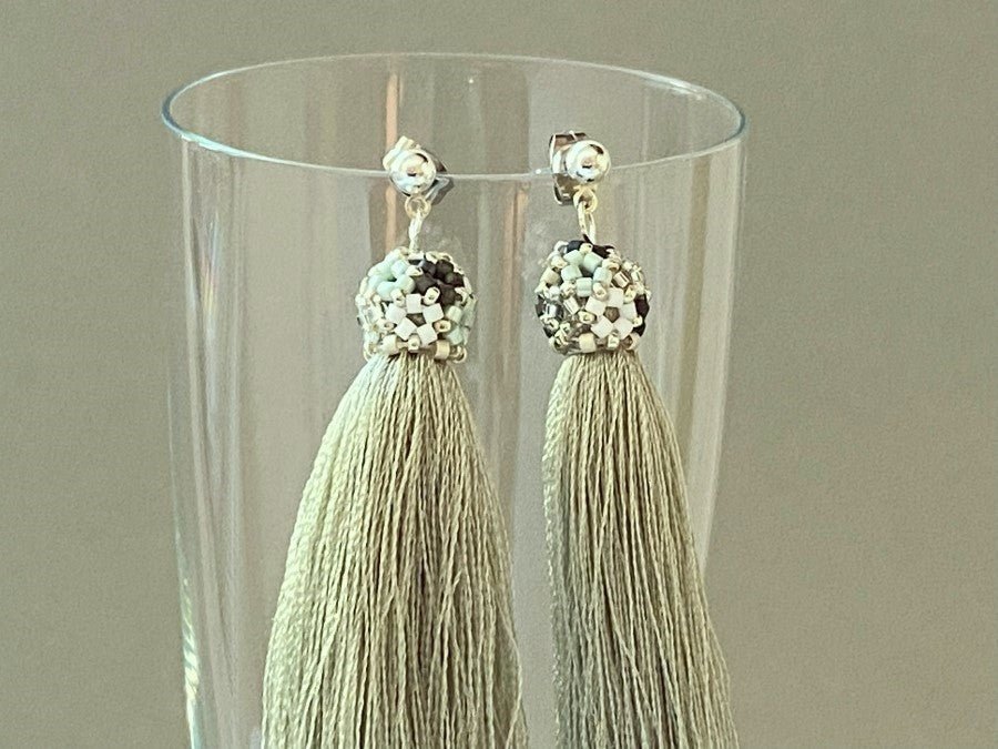Handmade earrings are crafted from a shimmering mint tassel which is covered with a floral cap - Ornamentico shop