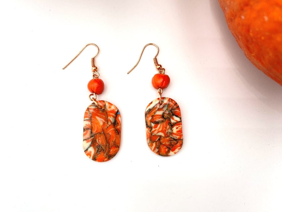 Handmade earrings made from polymer clay decorated with pumpkin bead - Ornamentico shop