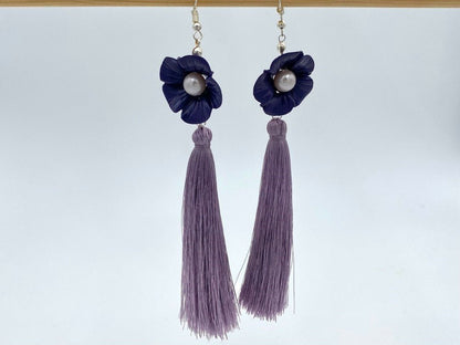Handmade earrings featuring violet polymer clay flowers, river pearls and long rayon tassels - Ornamentico shop