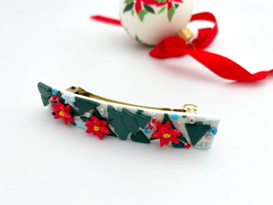 Handmade hair barrette from polymer clay featuring festive ornament of spruce trees, poinsettia flowers and snowflakes - Ornamentico shop