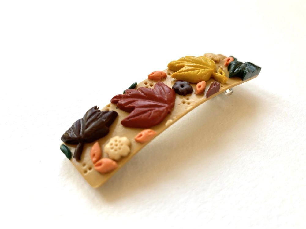 Handmade hair barrette decorated with polymer clay ornament featuring autumn maple leaves - Ornamentico shop