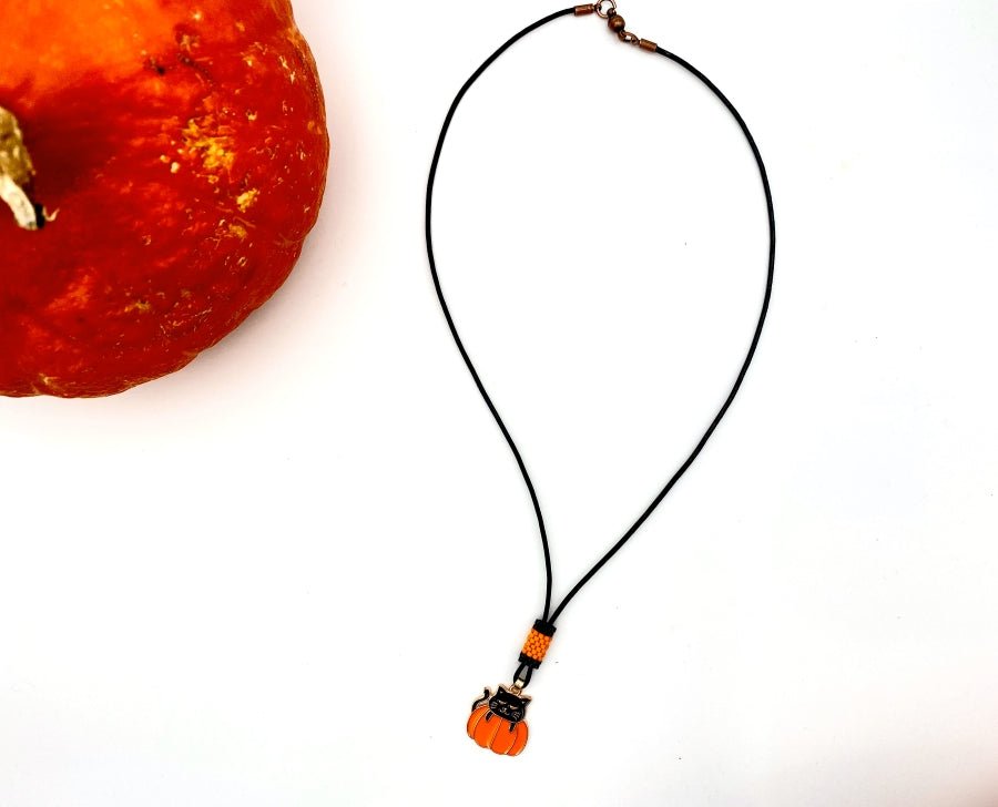 Handmade necklace on leather cord with enameled charm and beaded inlay - Ornamentico shop