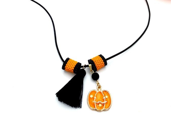 Handmade leather necklace with Halloween pumpkin charm and tassel - Ornamentico shop