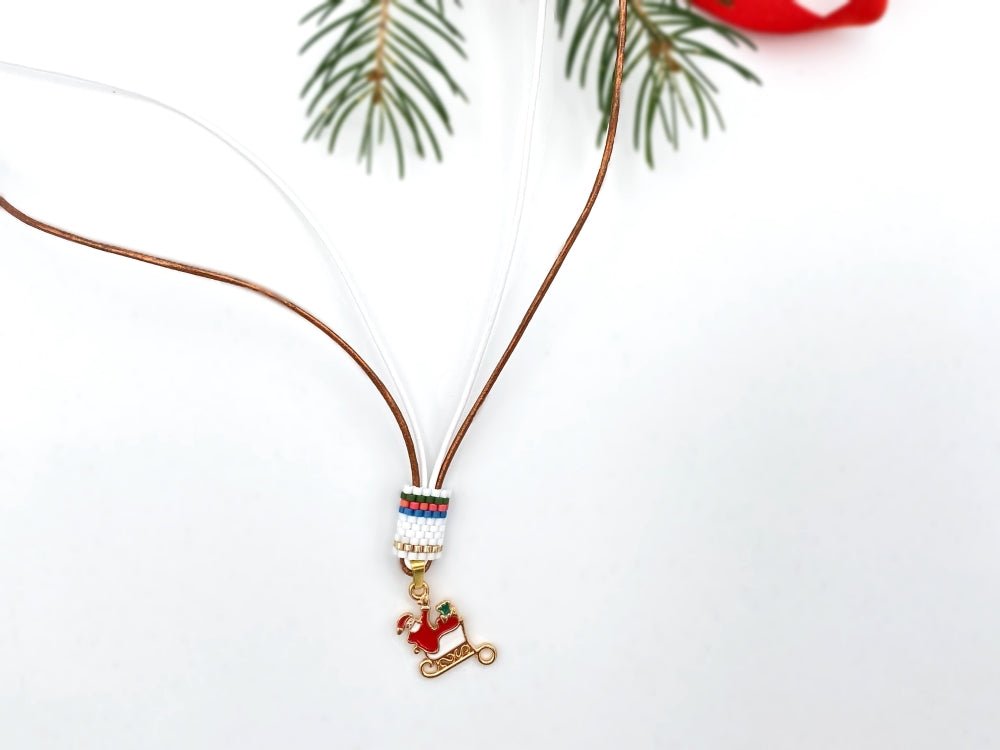Handmade leather necklace decorated with enameled charm in the shape of Santa accented with beaded inlay - Ornamentico shop