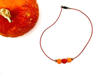 Handmade necklace on leather cord with three pumpkin beads - Ornamentico shop