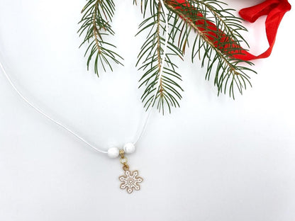 Handmade leather necklace with charm in the shape of a snowflake accented with two natural stone beads - Ornamentico shop