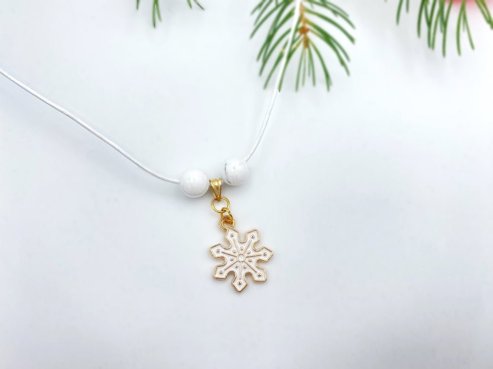 Handmade leather necklace with charm in the shape of a snowflake accented with two natural stone beads - Ornamentico shop
