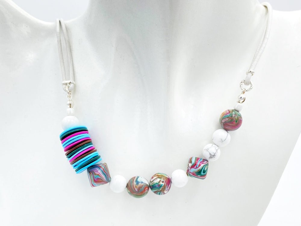 Handmade necklace crafted in traditional winter colors of white, blue, red and green from clay beads - Ornamentico shop