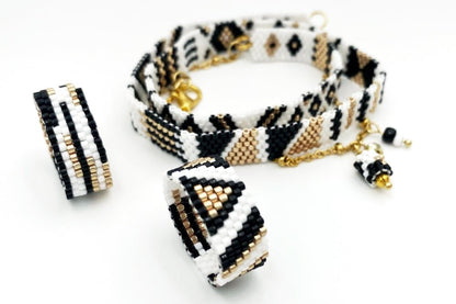 Jewelry set of bracelet and two rings made in geometrical design from black, white and gold Miyuki beads - Ornamentico shop