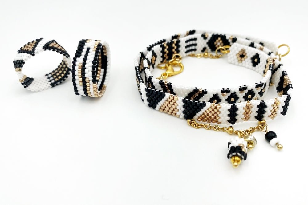 Jewelry set of bracelet and two rings made in geometrical design from black, white and gold Miyuki beads - Ornamentico shop