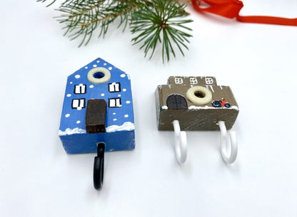 Two wooden hooks in the shape of a house and a barn decorated for Christmas - Ornamentico shop